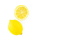 Whole and half lemons on white background 