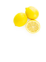 Three whole and half lemons on white background 
