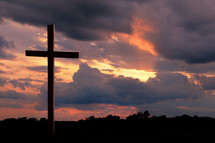 Wooden cross at sunset.