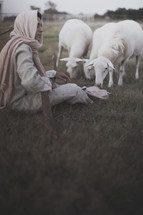 resting shepherd watching over his flock 