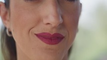 Mouth With Fuchsia Lipstick Of A Woman Smiling Slightly