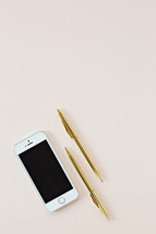 gold pens and iPhone 