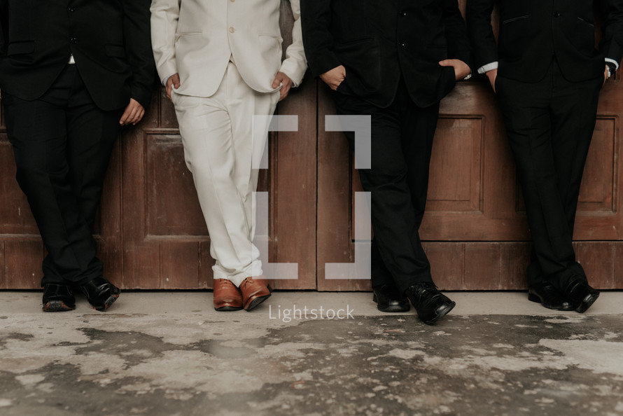 legs of groom and groomsmen 