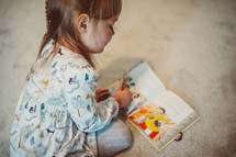 child reading a children's Bible 