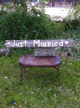 "Just Married" wood sign on chair