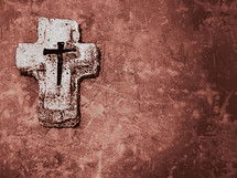 cross with nails on a reddish brown background 