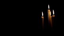 Flickering candles on a black background