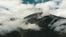 Steam Clouds Over Tungurahua Summit In The Cordillera Oriental Of Ecuador. Aerial Drone Shot	