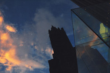 silhouette of a cathedral steeple and glass reflection 