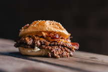 Beef burger with cheese and a sesame seed bun, gourmet hamburger, fast food and takeaway