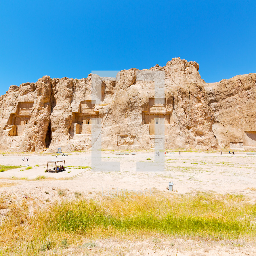 ruins carved into a mountainside in Iran 