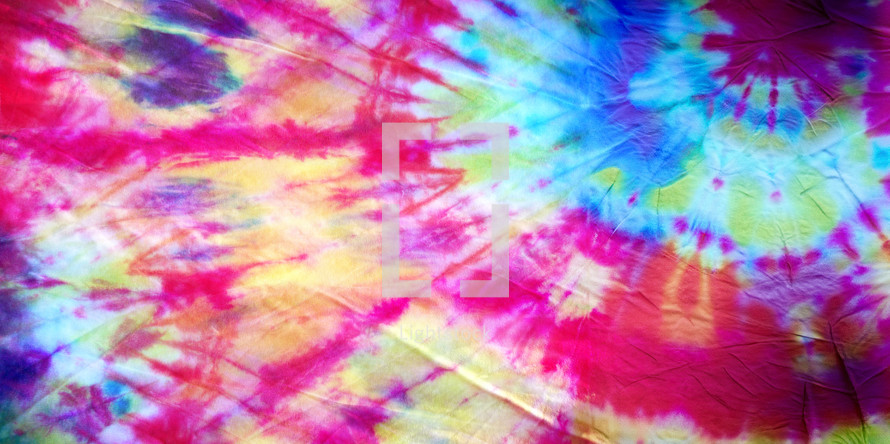 colorful tie dyed fabric background in a wide format