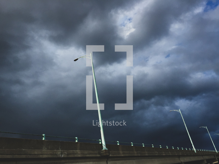 storm clouds over a bridge 