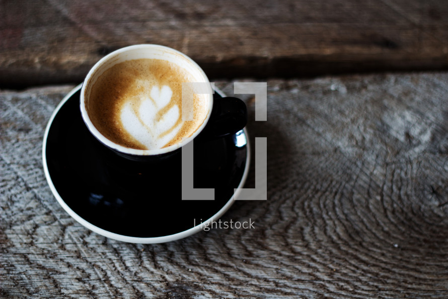 a cappuccino  on a wood table 