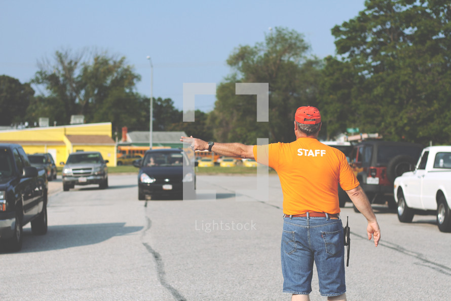 man directing parking traffic 