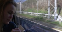 Woman making sketches during train ride