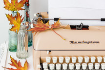 blank paper on a typewriter in a fall scene 