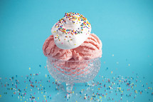 A Strawberry Ice Cream Sundae on a Bright Blue Background 