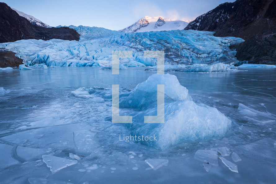 Frozen lake and icebergs in front of Mendenhall Glacier in Juneau, Alaska.
