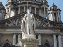 BELFAST, UK - CIRCA JUNE 2018: Queen Victoria statue in front of the Belfast City Hall