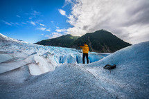 a man climbing a glacier 