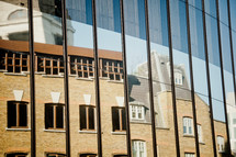 reflection of buildings on glass in London