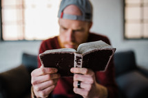 a man reading a Bible 