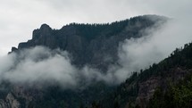 clouds over a mountain peak 