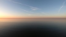 Forward shot of waves of Langeoog Island, Germany at the sunset.