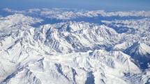 aerial view over snowy mountains 