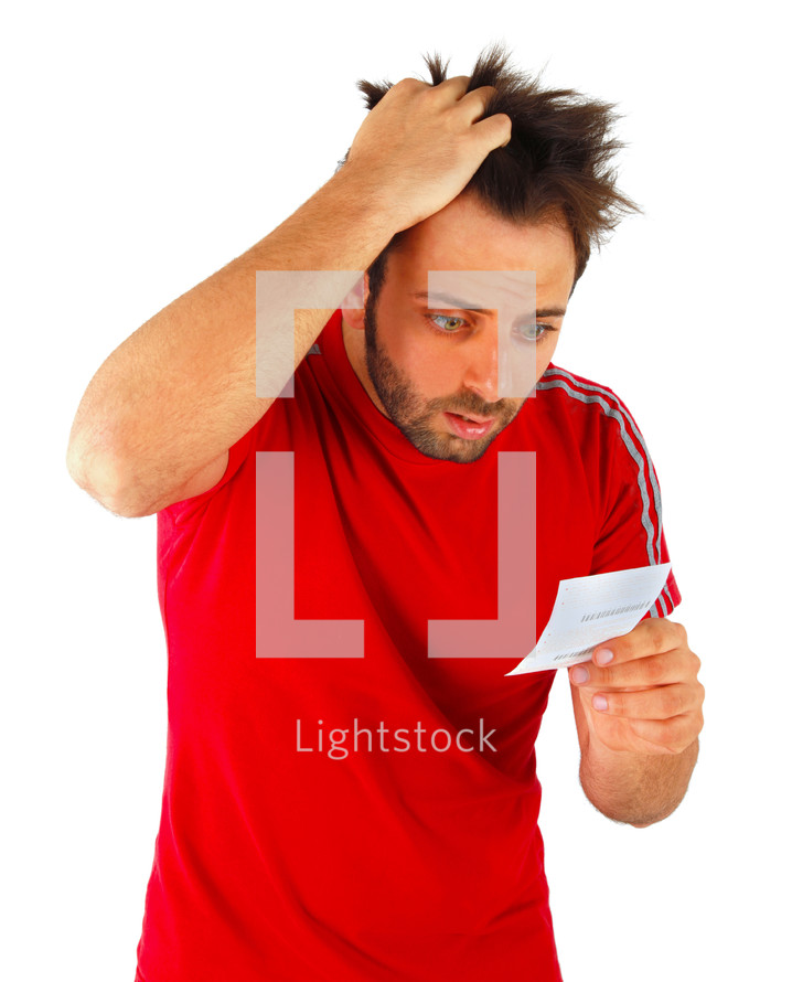 man with a surprised expression bet slip on white background