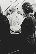 congregation reading scripture