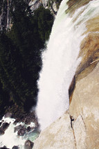 water rushing over a waterfall in Yosemite