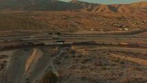 aerial view over traffic on a highway and a train on the tracks in Palm Springs 