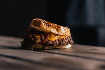 Beef burger with cheese and a sesame seed bun, gourmet hamburger, fast food and takeaway