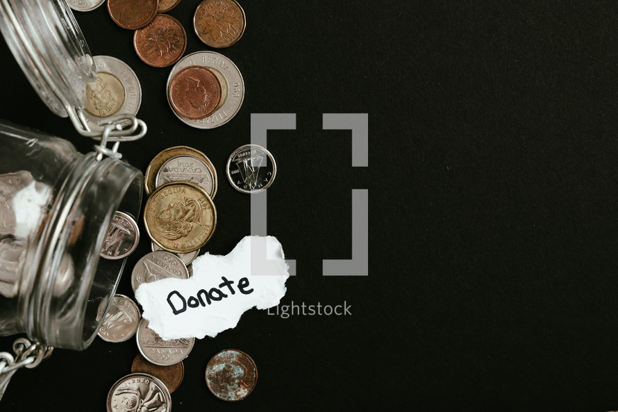 Coins coming out of jar on a black background with the word Donate