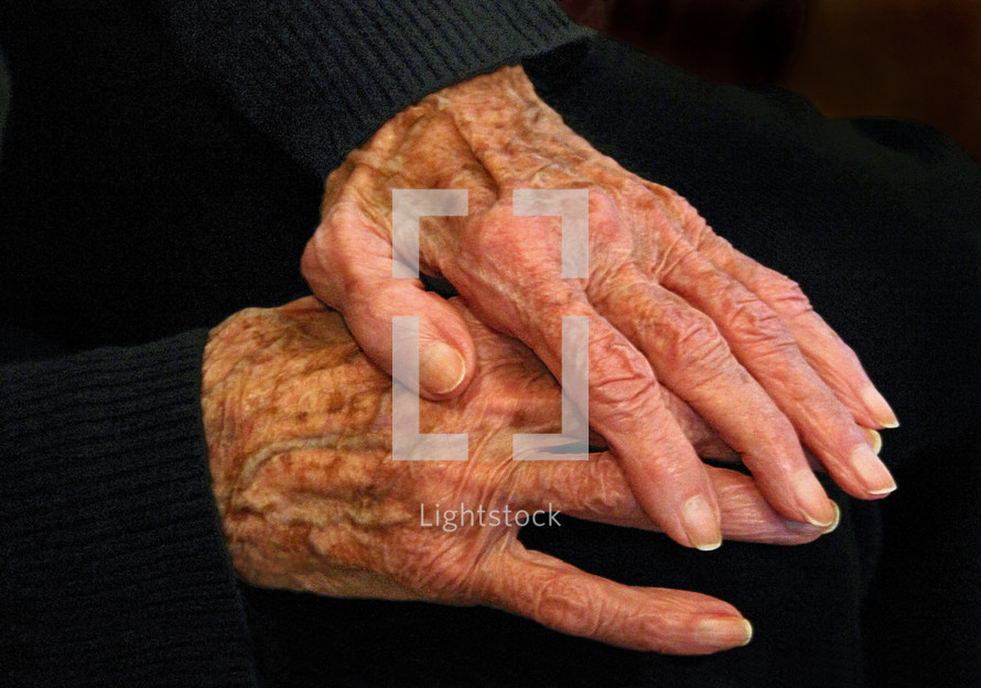 elderly hands at rest, color version
