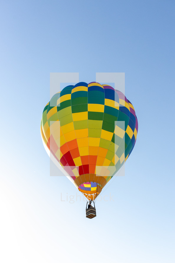 hot air baloon in a blue sky 