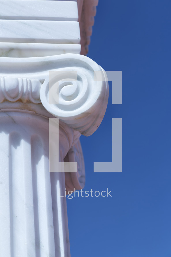 white column against a blue sky 