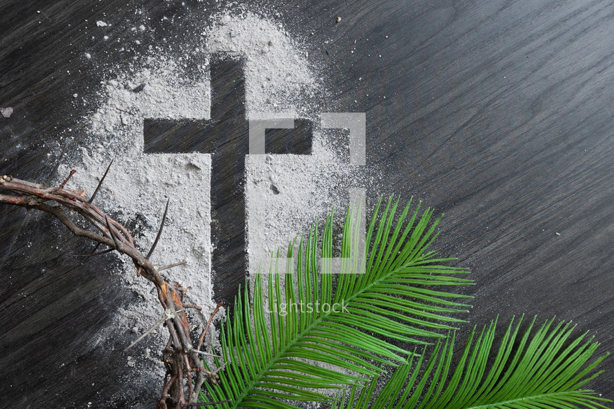 Ashes cross with crown of thorns and palm leaves