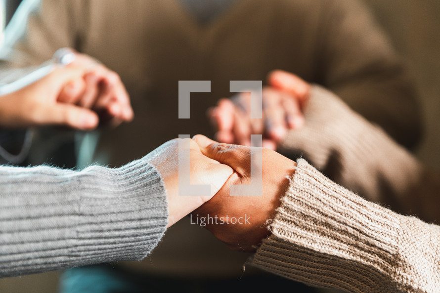 Hands folded together in prayer