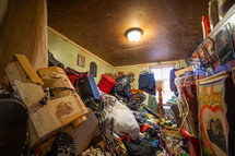 Hoarder's home, piles of things, messy consumerism. 