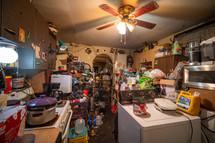 Hoarder's home, piles of things, messy consumerism. 