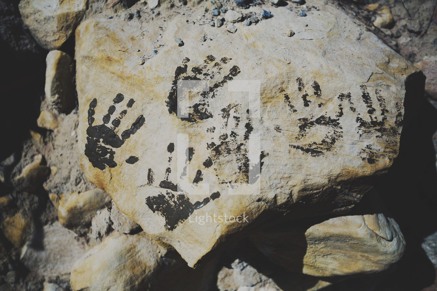 handprints on rock 