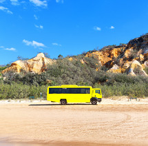 tour bus on a beach 