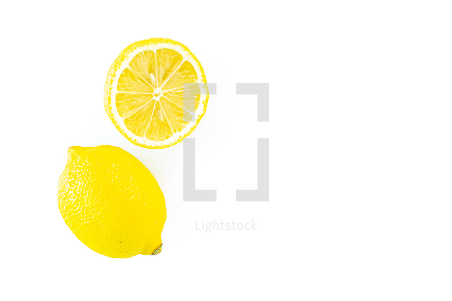 Whole and half lemons on white background 