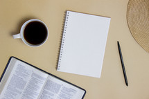 coffee cup, open Bible, journal 