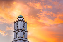 a steeple at sunset 