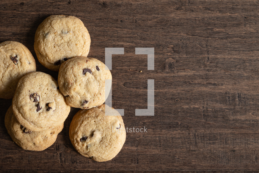 chocolate chip cookies on a wood background 