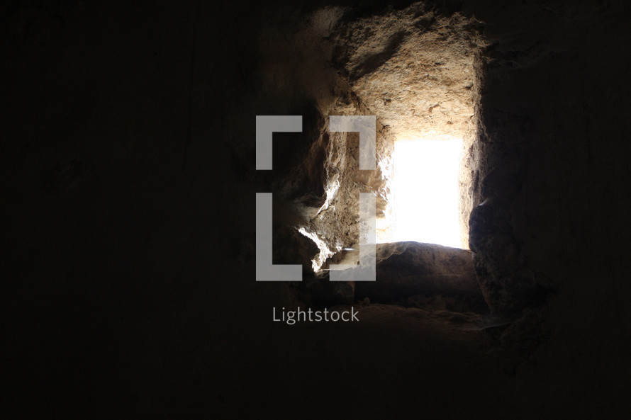 Light shining through a thick stone wall.